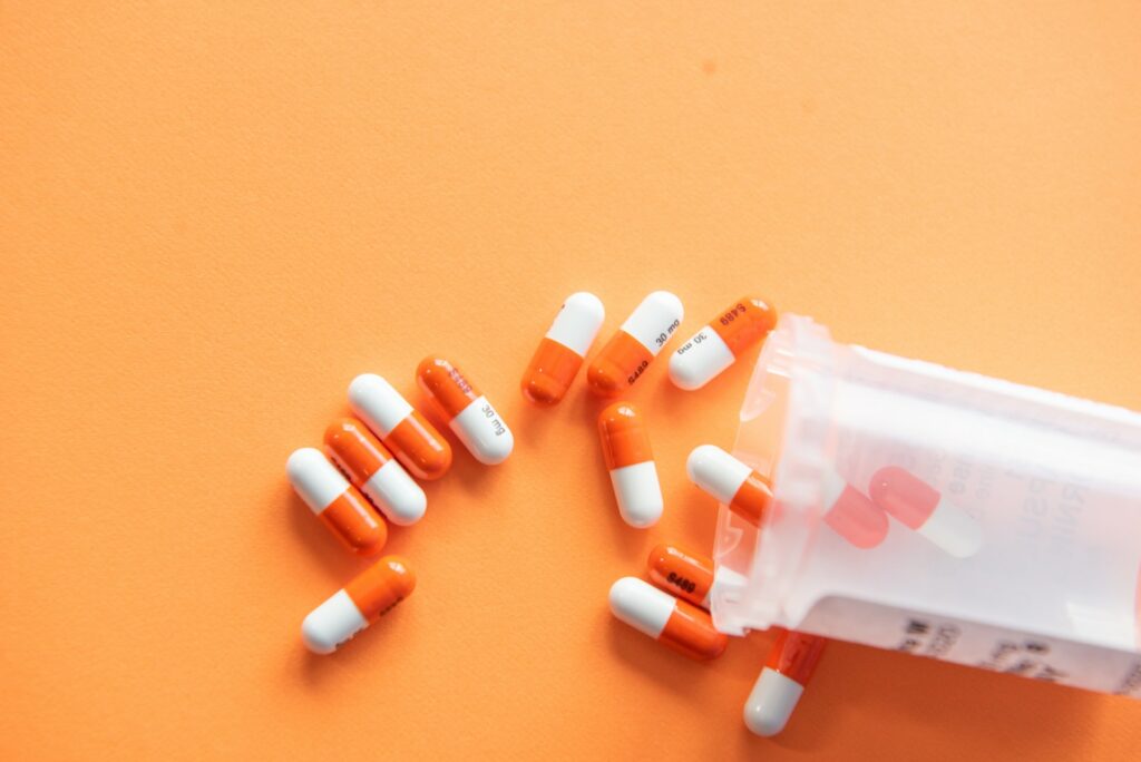Medicines on a surface poured out of the bottle