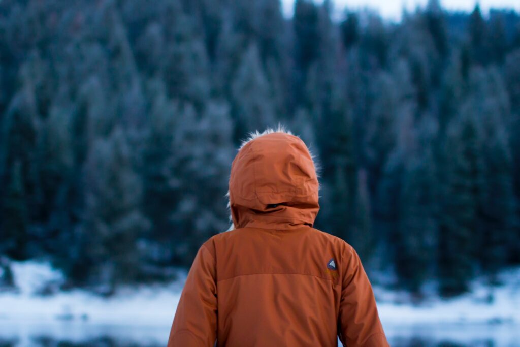 Person stood outside in cold weather with a jacket on.